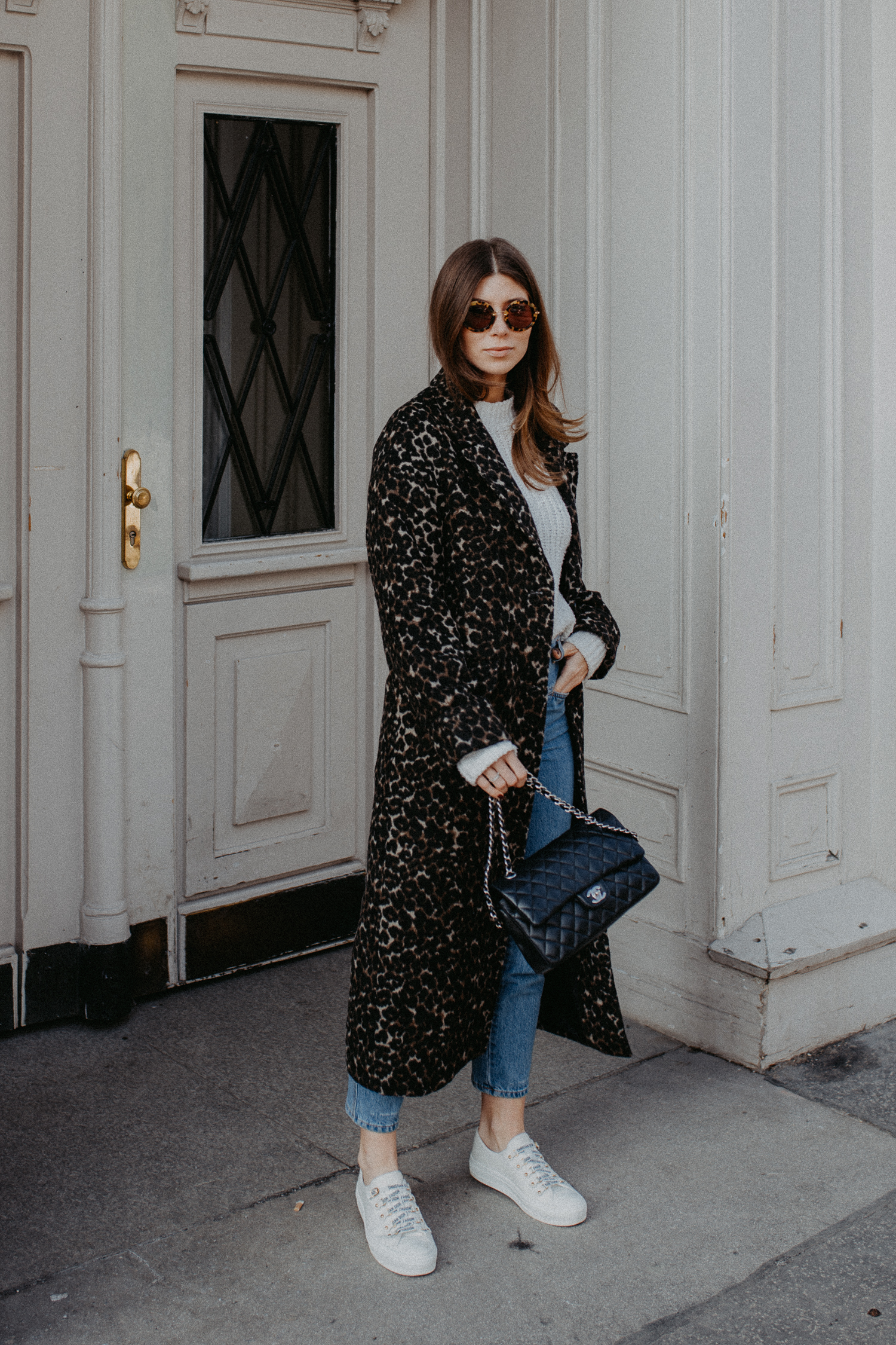 Outfit: long leo coat + Dior sneakers | Bikinis & Passports