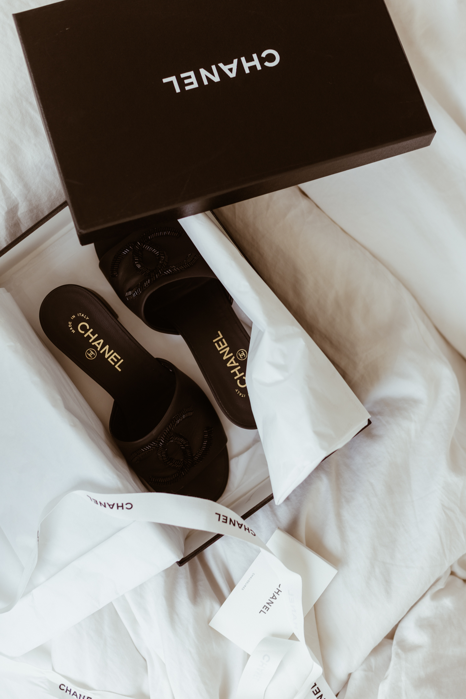 Chanel Mules: 50mm logo mules - Bikinis & Passports