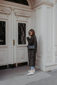 Outfit: long leo coat + Dior sneakers | Bikinis & Passports